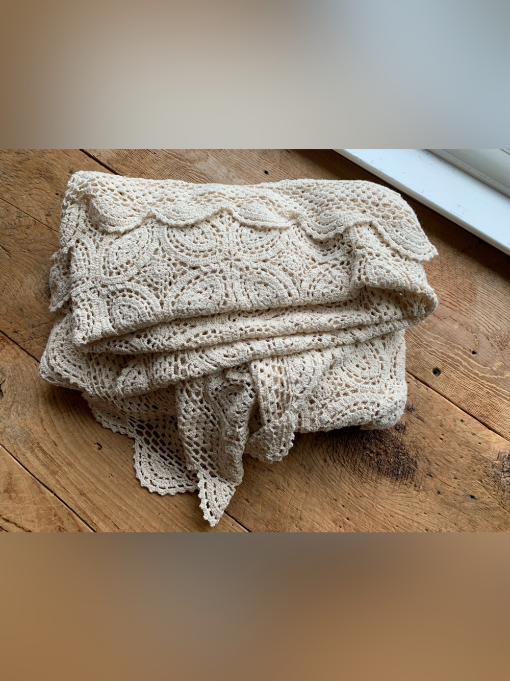 Large cream-colored vintage crochet tablecloth